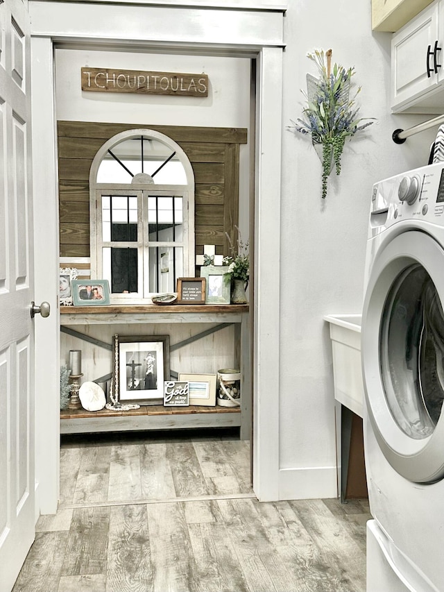 83 Azure Pl, Miramar Beach, FL 32550 - laundry room with washer / dryer and wood finished floors
