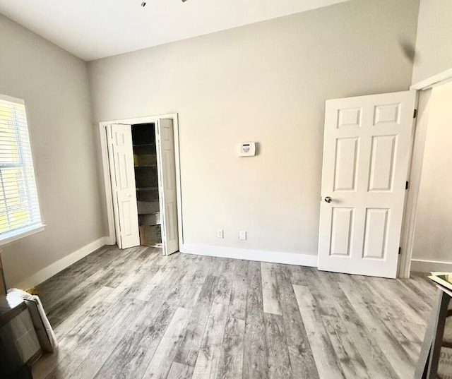 83 Azure Pl, Miramar Beach, FL 32550 - unfurnished bedroom with wood finished floors and a closet