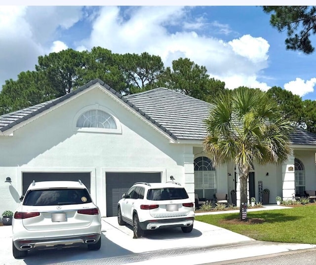 83 Azure Pl, Miramar Beach, FL 32550 - single story home with a garage, stucco siding, concrete driveway, and a tile roof