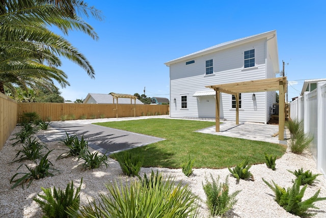 7215 Sunset Ave, Panama City Beach, FL 32408 - back of house with a pergola, a patio area, and a fenced backyard