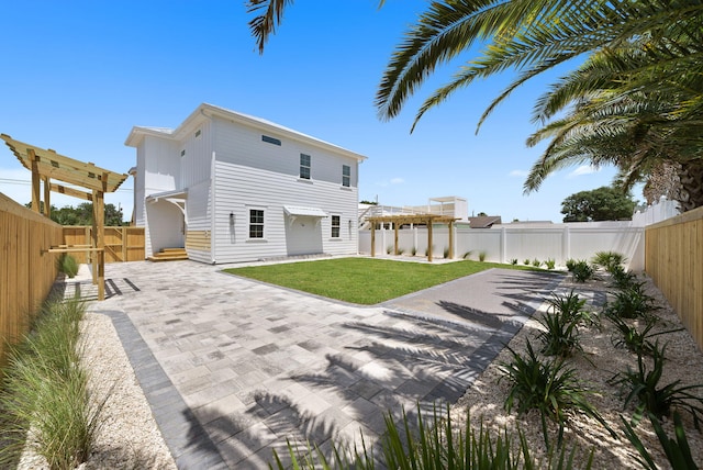 7215 Sunset Ave, Panama City Beach, FL 32408 - rear view of house featuring a fenced backyard and a patio area