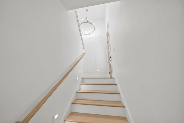 7215 Sunset Ave, Panama City Beach, FL 32408 - staircase with a chandelier
