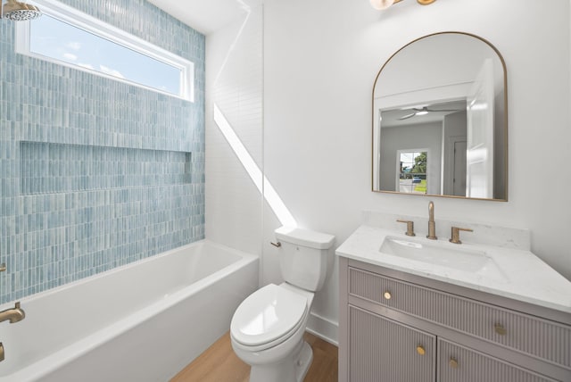 7215 Sunset Ave, Panama City Beach, FL 32408 - full bath featuring vanity, wood finished floors, a ceiling fan, and shower / bathtub combination