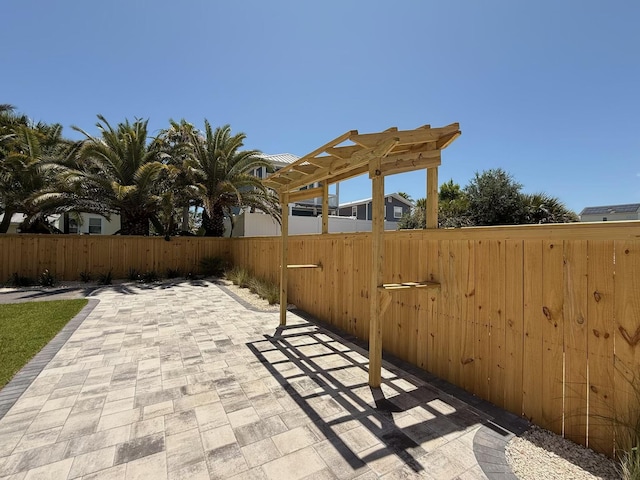 7215 Sunset Ave, Panama City Beach, FL 32408 - fenced backyard with a patio