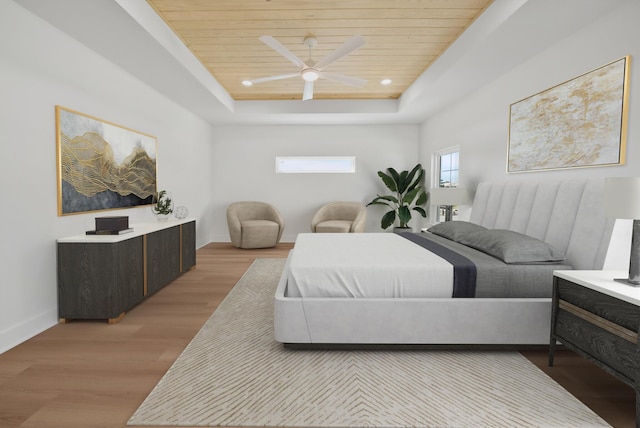 7215 Sunset Ave, Panama City Beach, FL 32408 - bedroom featuring wood ceiling, a tray ceiling, light wood finished floors, and ceiling fan