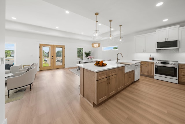 7215 Sunset Ave, Panama City Beach, FL 32408 - kitchen featuring stainless steel electric range, light wood-style floors, recessed lighting, dishwasher, and light countertops