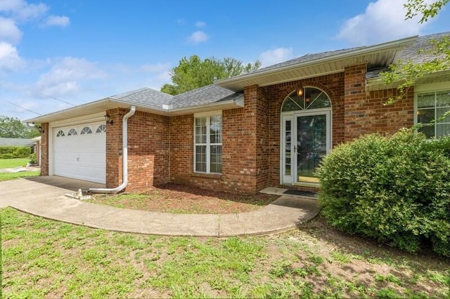 527 Tom Sawyer Ln, Crestview, FL 32536 - view of front of home with a garage, concrete driveway, and brick siding