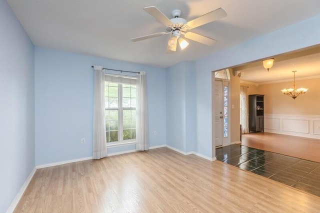 527 Tom Sawyer Ln, Crestview, FL 32536 - spare room with a chandelier, ceiling fan, and wood finished floors