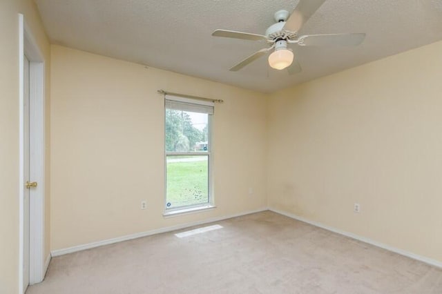 527 Tom Sawyer Ln, Crestview, FL 32536 - unfurnished room with light carpet, ceiling fan, and a textured ceiling