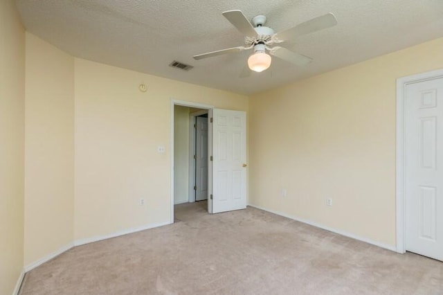 527 Tom Sawyer Ln, Crestview, FL 32536 - unfurnished bedroom with light carpet, ceiling fan, and a textured ceiling
