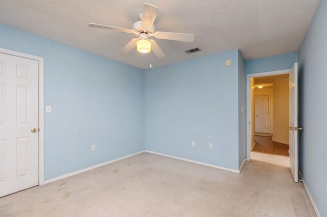 527 Tom Sawyer Ln, Crestview, FL 32536 - unfurnished bedroom with carpet flooring, a textured ceiling, and a ceiling fan