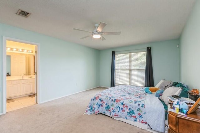 527 Tom Sawyer Ln, Crestview, FL 32536 - carpeted bedroom featuring ensuite bath and a ceiling fan