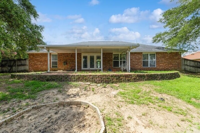 527 Tom Sawyer Ln, Crestview, FL 32536 - view of front of property featuring brick siding and a patio area