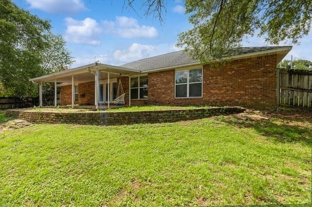 527 Tom Sawyer Ln, Crestview, FL 32536 - rear view of house with brick siding and a patio area
