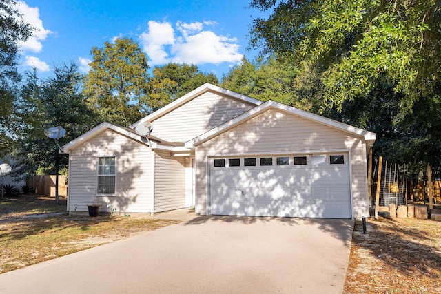 321 Timber Wind Dr, Defuniak Springs, FL 32433 - ranch-style house featuring an attached garage and driveway