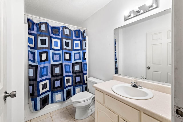 321 Timber Wind Dr, Defuniak Springs, FL 32433 - bathroom featuring tile patterned floors, vanity, and a textured ceiling