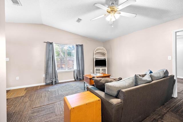 321 Timber Wind Dr, Defuniak Springs, FL 32433 - carpeted living room featuring ceiling fan, vaulted ceiling, and a textured ceiling