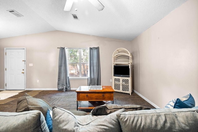 321 Timber Wind Dr, Defuniak Springs, FL 32433 - living area featuring carpet floors, lofted ceiling, a ceiling fan, and a textured ceiling