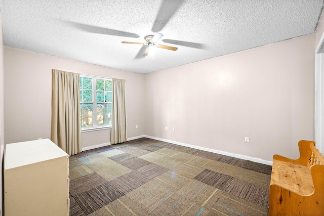 321 Timber Wind Dr, Defuniak Springs, FL 32433 - carpeted spare room with a ceiling fan and a textured ceiling