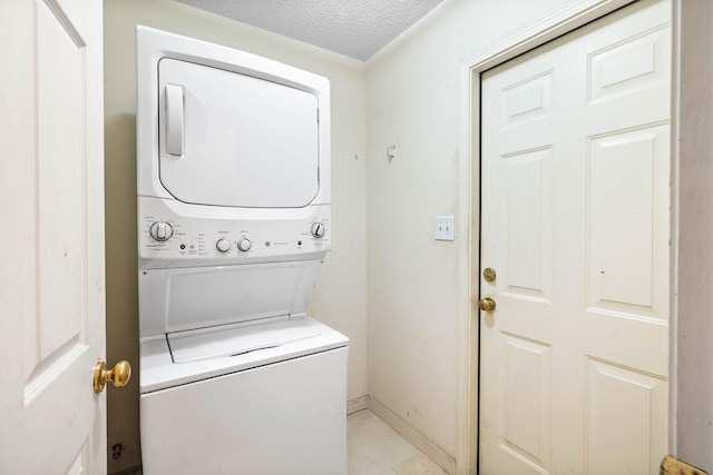 321 Timber Wind Dr, Defuniak Springs, FL 32433 - laundry room with stacked washer / dryer and a textured ceiling