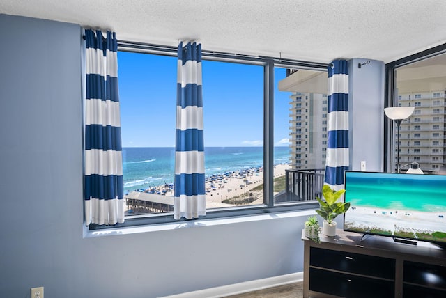9850 S Thomas Dr Unit 1012W, Panama City, FL 32408 - bedroom featuring a textured ceiling and wood finished floors