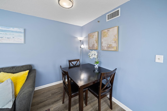 9850 S Thomas Dr Unit 1012W, Panama City, FL 32408 - dining area featuring wood finished floors and baseboards