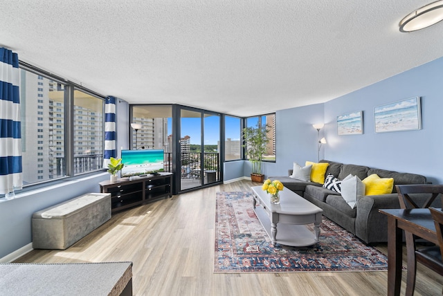 9850 S Thomas Dr Unit 1012W, Panama City, FL 32408 - living area featuring a textured ceiling and wood finished floors