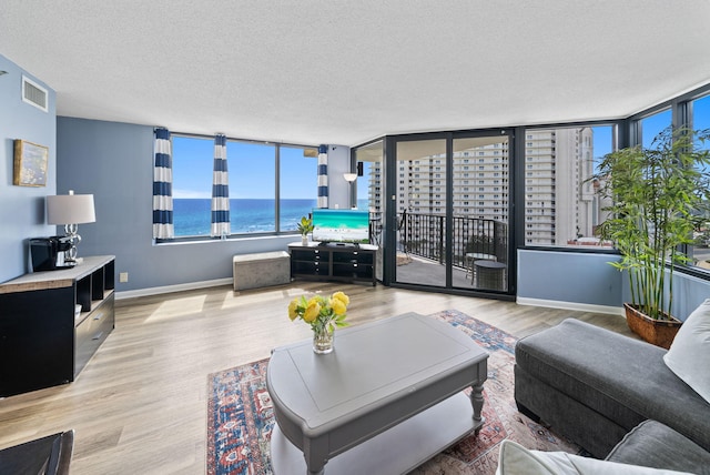 9850 S Thomas Dr Unit 1012W, Panama City, FL 32408 - living area with a textured ceiling and wood finished floors