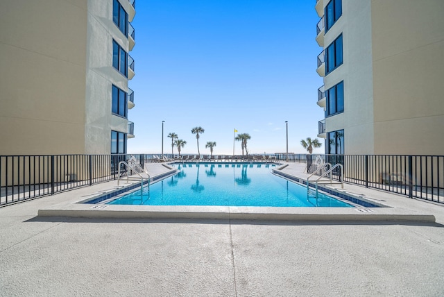9850 S Thomas Dr Unit 1012W, Panama City, FL 32408 - community pool featuring a patio area