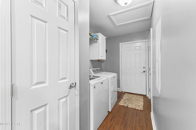 1069 Caswell Rd, Defuniak Springs, FL 32433 - laundry room featuring independent washer and dryer, attic access, cabinet space, and dark wood-style floors