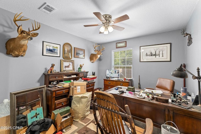 1069 Caswell Rd, Defuniak Springs, FL 32433 - home office with a ceiling fan and a textured ceiling