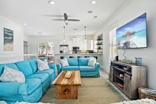 30 Los Angeles St, Miramar Beach, FL 32550 - living area featuring a ceiling fan, recessed lighting, ornamental molding, and light wood-style floors