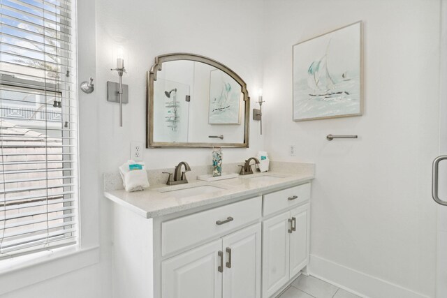 30 Los Angeles St, Miramar Beach, FL 32550 - bathroom with plenty of natural light, double vanity, tile patterned floors, and a shower with shower door