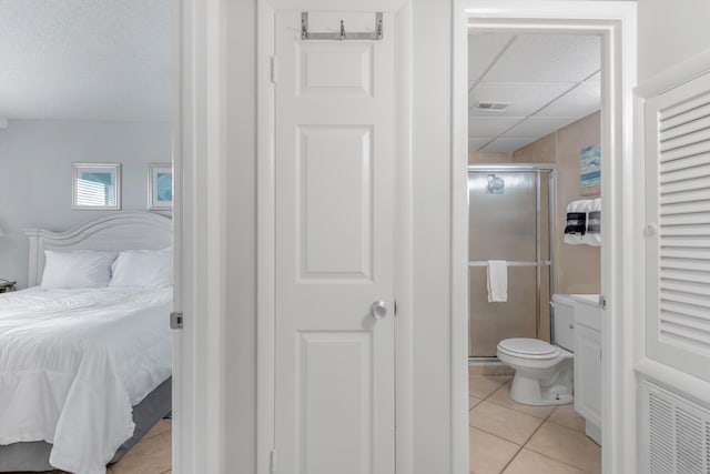885 Santa Rosa Blvd Unit 208, Fort Walton Beach, FL 32548 - bedroom with a paneled ceiling, light tile patterned floors, and ensuite bathroom