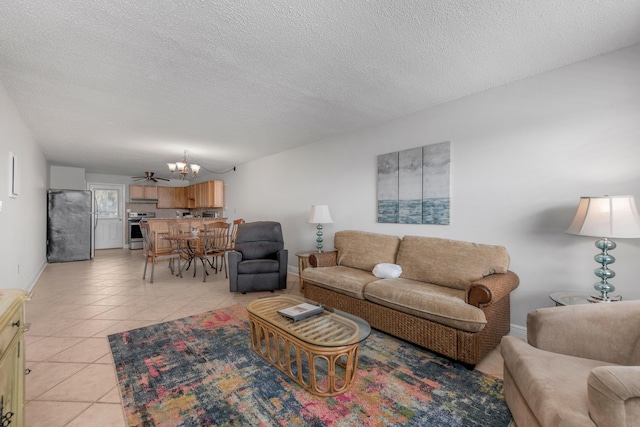 885 Santa Rosa Blvd Unit 208, Fort Walton Beach, FL 32548 - living area featuring a chandelier, light tile patterned flooring, and a textured ceiling