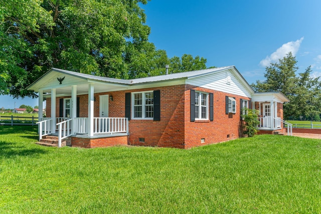942 Varnum Rd, Laurel Hill, FL 32567 - ranch-style house featuring crawl space, a porch, brick siding, and a metal roof