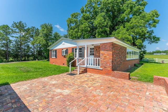 942 Varnum Rd, Laurel Hill, FL 32567 - ranch-style home featuring crawl space, brick siding, and a patio area
