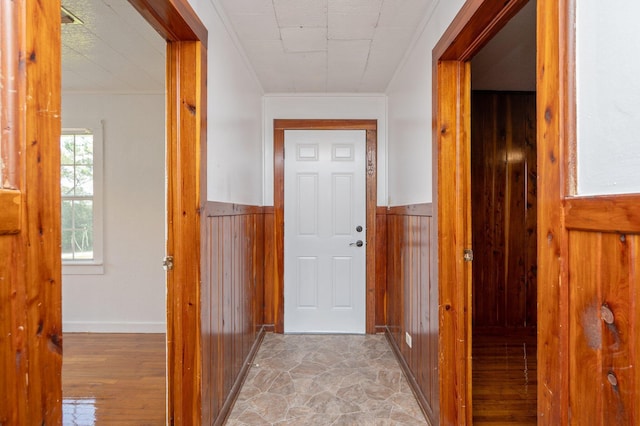 942 Varnum Rd, Laurel Hill, FL 32567 - doorway with wooden walls, wainscoting, and light wood-style floors