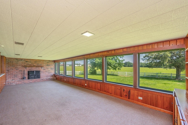 942 Varnum Rd, Laurel Hill, FL 32567 - unfurnished sunroom with a brick fireplace