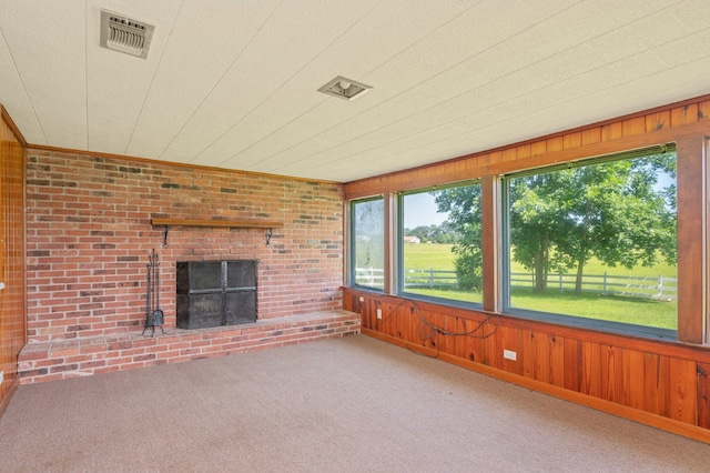 942 Varnum Rd, Laurel Hill, FL 32567 - unfurnished sunroom featuring healthy amount of natural light, wooden walls, and carpet