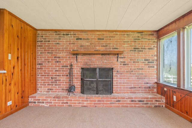942 Varnum Rd, Laurel Hill, FL 32567 - detailed view of wooden walls, carpet, a brick fireplace, and ornamental molding