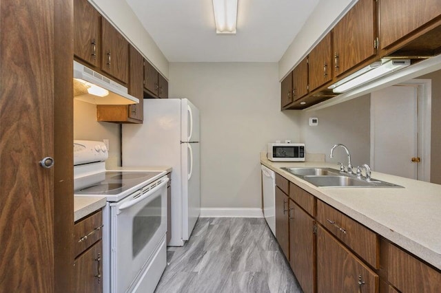 613 Colonial Dr Apt 5, Fort Walton Beach, FL 32547 - kitchen with white appliances, under cabinet range hood, and light countertops