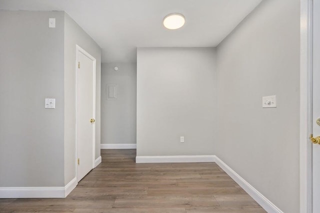 613 Colonial Dr Apt 5, Fort Walton Beach, FL 32547 - spare room featuring wood finished floors and baseboards