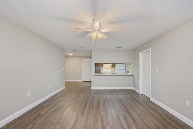613 Colonial Dr Apt 5, Fort Walton Beach, FL 32547 - unfurnished living room with ceiling fan and wood finished floors