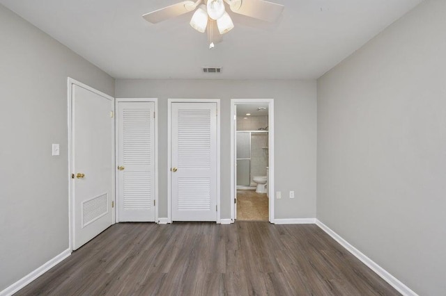 613 Colonial Dr Apt 5, Fort Walton Beach, FL 32547 - unfurnished bedroom featuring wood finished floors, connected bathroom, and ceiling fan