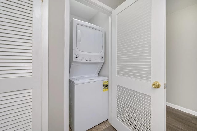 613 Colonial Dr Apt 5, Fort Walton Beach, FL 32547 - washroom with stacked washer / dryer and wood finished floors