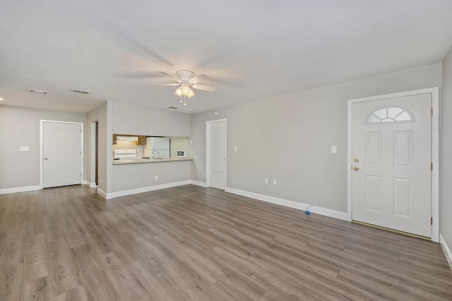 613 Colonial Dr Apt 5, Fort Walton Beach, FL 32547 - unfurnished living room featuring ceiling fan and wood finished floors