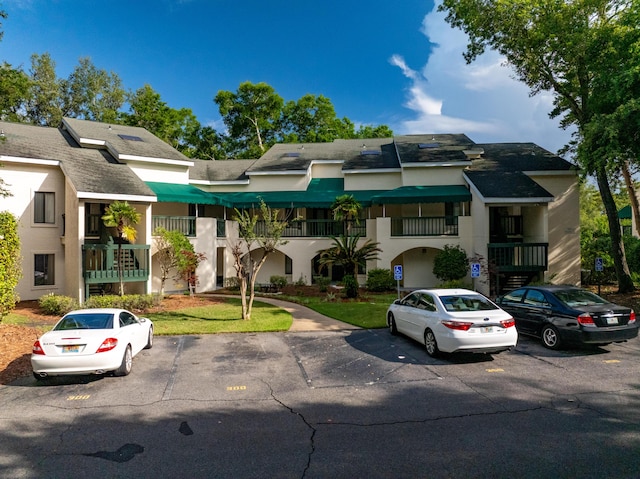 310 Westlake Ct Unit 310, Niceville, FL 32578 - multi unit property with uncovered parking, stucco siding, and roof with shingles