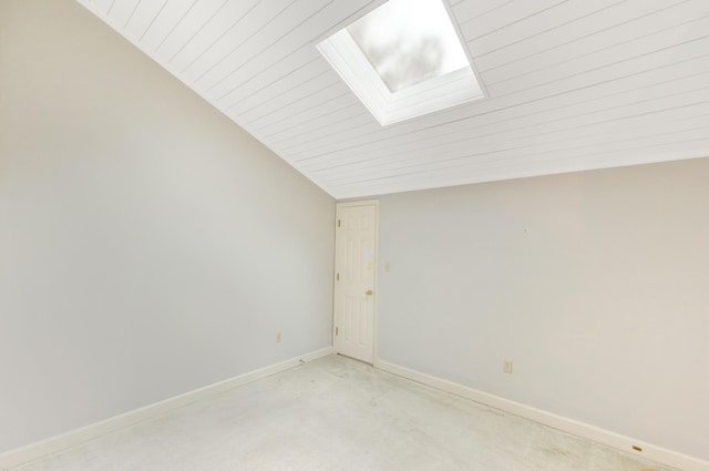 310 Westlake Ct Unit 310, Niceville, FL 32578 - empty room featuring a skylight, wood ceiling, and vaulted ceiling