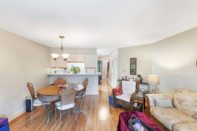 310 Westlake Ct Unit 310, Niceville, FL 32578 - dining room featuring light wood-style floors and a chandelier